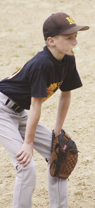 Moose third baseman Isaiah Bayle blows a bubble.
